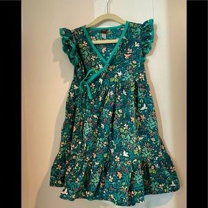 Beautiful dark green print dress. Great condition. Size 5. Tea collection.